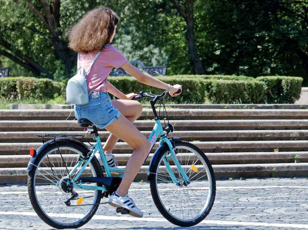 If there is that much traffic around schools, putting children on bicycles seems to be a risky move.